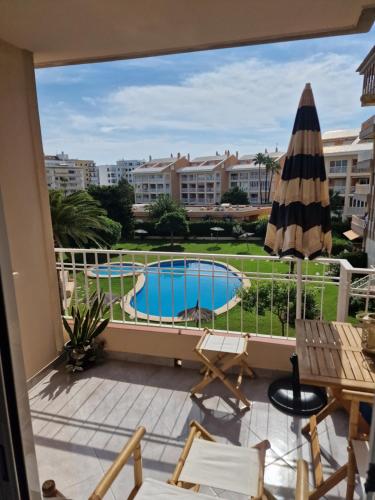a balcony with a view of a swimming pool at Arenal in Jávea