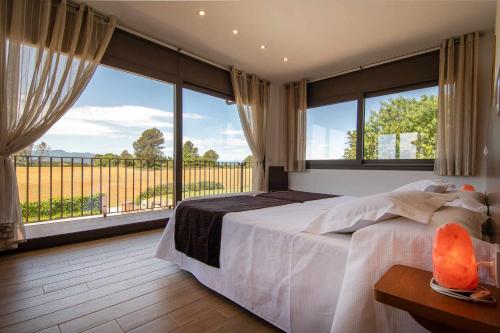 Posteľ alebo postele v izbe v ubytovaní Villa de vacaciones con encanto El Serrat