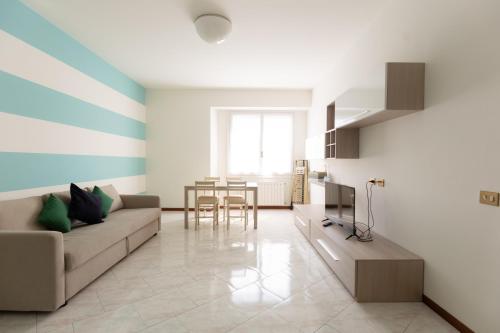 a living room with a couch and a table at Carola's place - by Relais Di Giada in Como