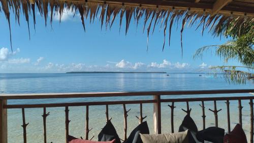 a view of the ocean from a resort balcony at Islahazul Hostel in General Luna