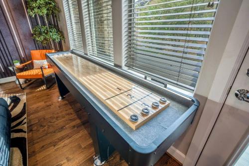 a table in a room with a window at Posh Dtwn/Midtown Home w Stunning Roof-Top Terrace in Houston