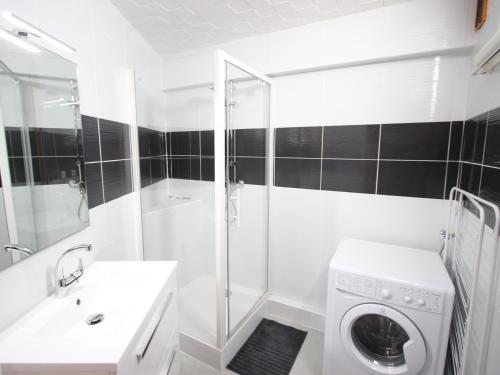 a white bathroom with a washing machine in it at Appartement Chamrousse, 2 pièces, 6 personnes - FR-1-549-109 in Chamrousse