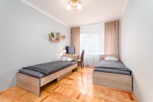 Postel nebo postele na pokoji v ubytování Two Bedrooms Apartment FAKTURA FAST CHECK-IN 24H