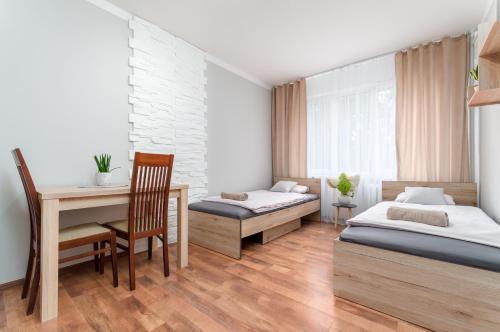 Ένα ή περισσότερα κρεβάτια σε δωμάτιο στο Two Bedrooms Apartment FAKTURA FAST CHECK-IN 24H