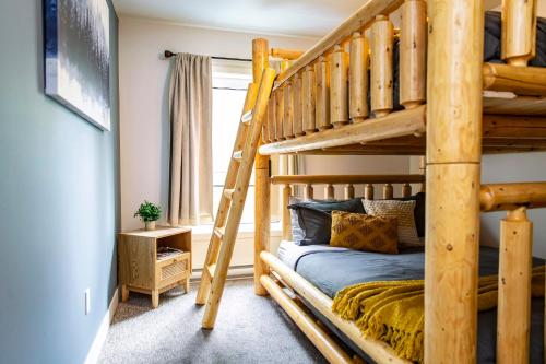 a bunk bed in a room with a bunk bedrocket at The Revy Dream in Revelstoke