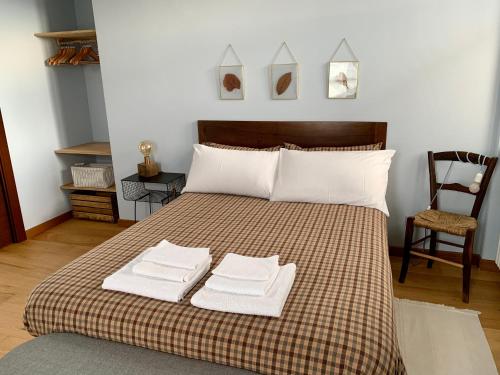 Postel nebo postele na pokoji v ubytování Cascina Villa - Casa di campagna tra le nocciole