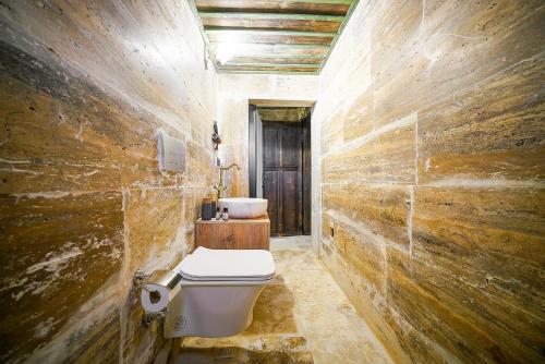 a bathroom with a toilet and a sink at Aysel Inn House in Goreme
