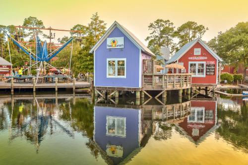 a group of buildings on the water at a carnival at Luau 6909 in Destin