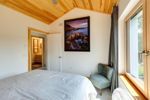 a bedroom with a bed and a window at Acadia Home with Rooftop Deck - Close to Trails! in Otter Creek