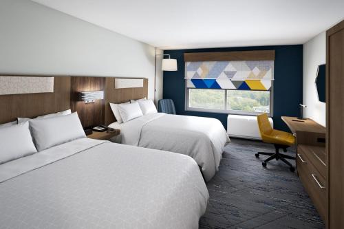 Postel nebo postele na pokoji v ubytování Holiday Inn Express & Suites Lima by IHG