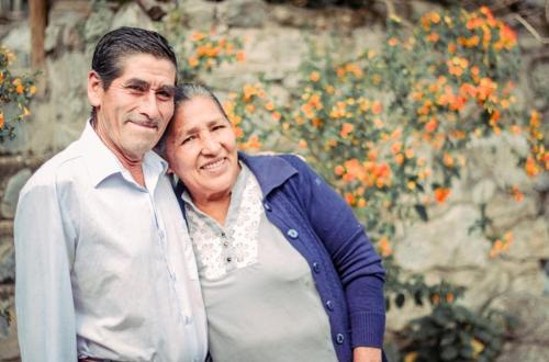 a man and a woman posing for a picture at Eco Hacienda Roman in Machu Picchu