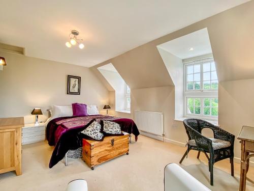 a bedroom with a large bed and a window at Badgers End in Maiden Bradley
