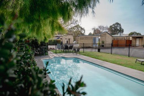 a swimming pool in the backyard of a house at Mitchell On Main in Bairnsdale