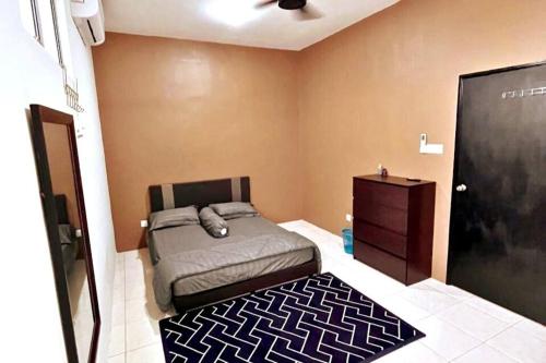 מיטה או מיטות בחדר ב-Suria Villa @ 5 mins A'famosa Resort