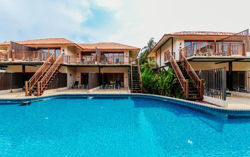 a large swimming pool in front of a building at Blue Bay Resort in Ko Yao Yai