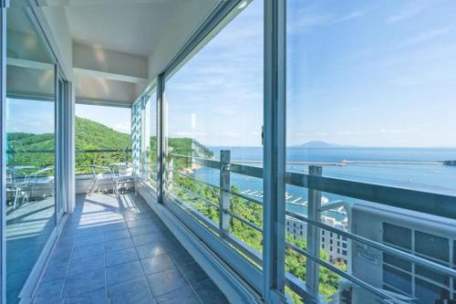 an empty balcony with a view of the ocean at Namhae Season Hotel in Namhae