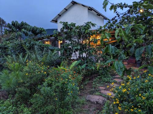 a house with a garden in front of it at Ivy Coffee Farm - Garden House in Ðưc Trọng