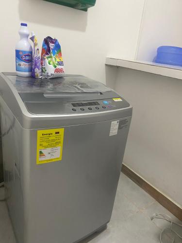 a small refrigerator in a kitchen with a counter at Amazonas magic in Leticia