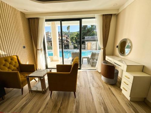 a living room with a view of a pool at Lake View Resort in Pokhara