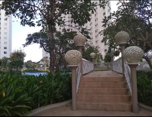 a set of stairs with baskets on them in a park at Apartemen Educity Pakuwon city Surabaya BACA DESKRIPSI DULU in Surabaya