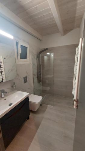 a bathroom with a sink and a toilet and a shower at GIORGIO LUXURY LOFT WITH AMAZING VIEW Of NAFPLIO in Nafplio