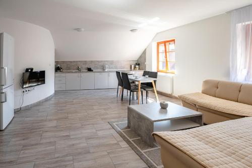 a living room with a couch and a table at Apartmaji Pr' Kopavank in Rateče