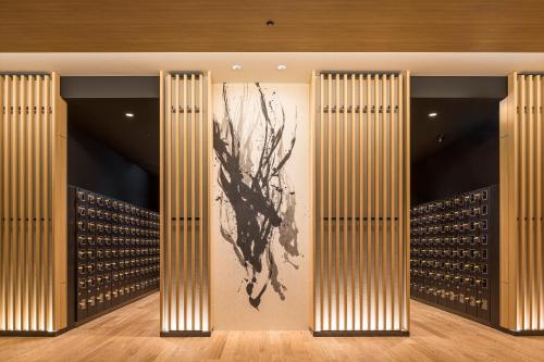 a room with wine racks and a painting on the wall at Villa Fontaine Grand Haneda Airport in Tokyo