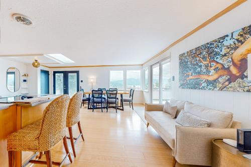 a living room with a couch and a table at Sound Views in Port Townsend in Port Townsend