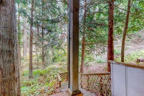 a screened in porch with a view of the woods at Sound Views in Port Townsend in Port Townsend