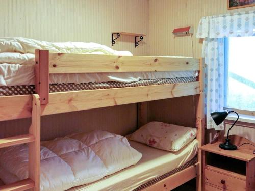 a couple of bunk beds in a bedroom at Two-Bedroom Holiday home in Digermulen in Digermulen