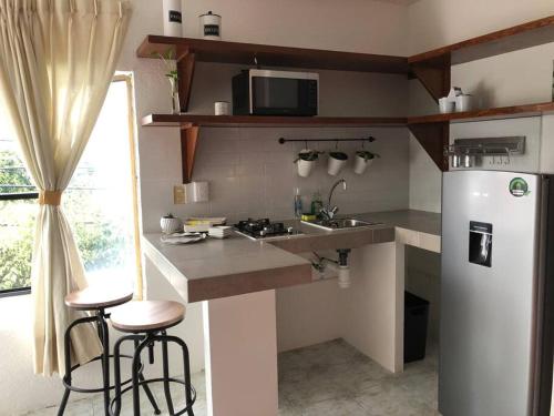 Кухня или мини-кухня в Apartaestudio #9 Aire acondicionado & cochera
