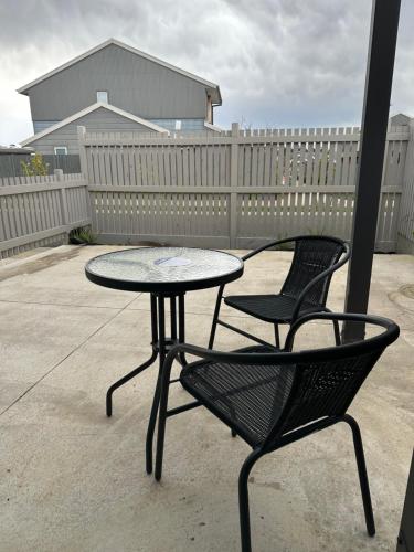 a table and two chairs sitting on a patio at 12 Stern Way New Gisborne in Gisborne