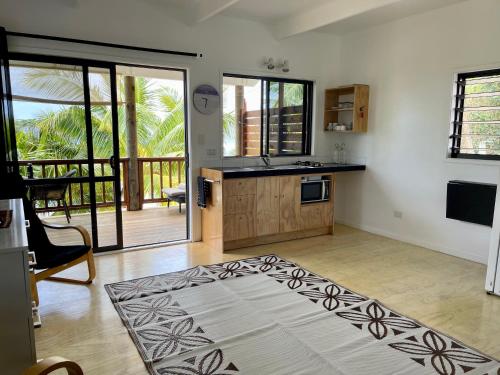a kitchen with a sink and a counter top at Rarotonga Villas Absolute Beachfront in Arorangi