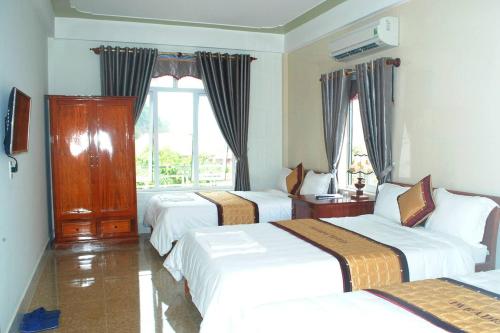 Ένα ή περισσότερα κρεβάτια σε δωμάτιο στο Paradise Hotel