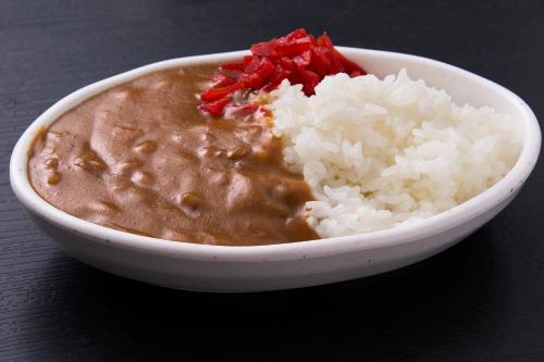 a bowl of soup and rice on a table at Hotel Select Inn Utsunomiya in Utsunomiya