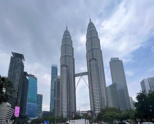 a group of three tall buildings in a city at lanai gurney corporate suites in Kuala Lumpur