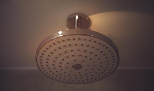 a ceiling light is hanging from a ceiling at Best Western Plus Delmere Hotel in London