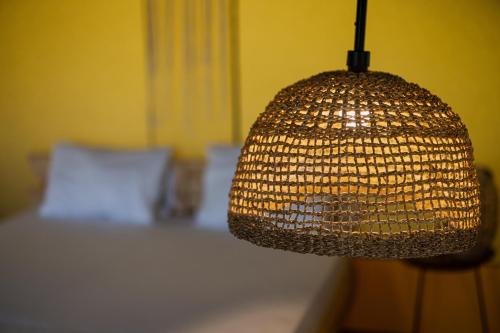 a close up of a lamp in a bedroom at Layla Glamping in Nir Dawid
