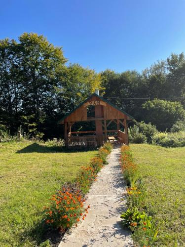 a path leading to a gazebo in a field at соколів камінь in Novoselitsa