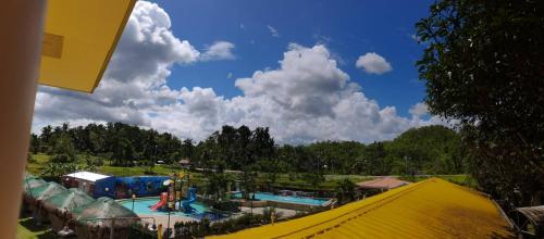 a view of a swimming pool at a resort at green aa garden resort in Sikatuna