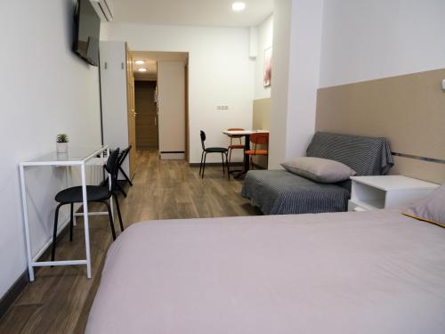 TV a/nebo společenská místnost v ubytování Alianza Suites