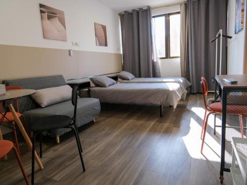 Postel nebo postele na pokoji v ubytování Alianza Suites