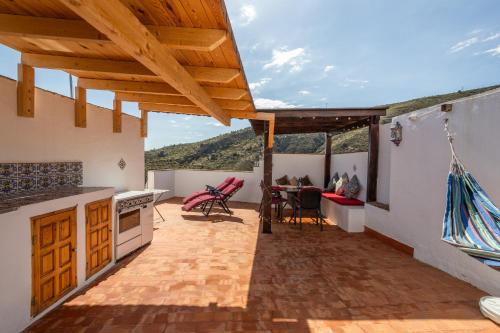 a kitchen with a view of a mountain at Zarzamora de Rubite in Rubite