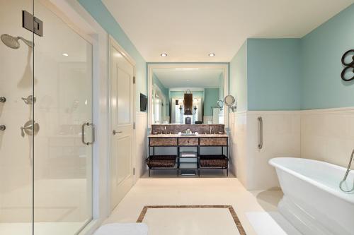 a bathroom with a tub and a sink at Salamander Resort and Spa in Middleburg