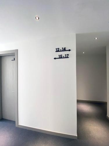 a white wall in a room with a sign on it at Hotel BESTPRICE Valencia in Valencia