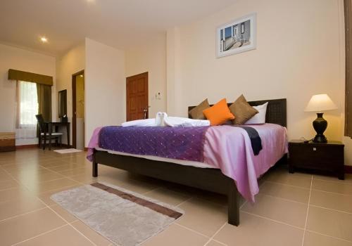 Postel nebo postele na pokoji v ubytování Samui Tonggad Resort