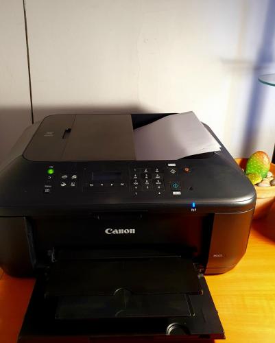 a black printer sitting on top of a desk at Helicon Muses Friendly Mountain B&B Guesthouse in Evangelístria