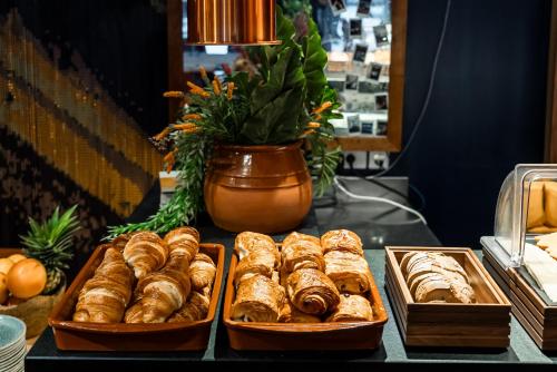 a table with three trays of pastries on it at 1K Paris in Paris