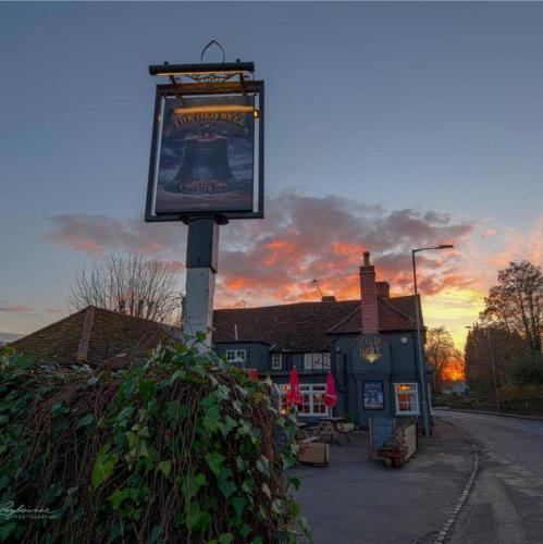 a sign on a pole in front of a building at The Old Bell in Wooburn