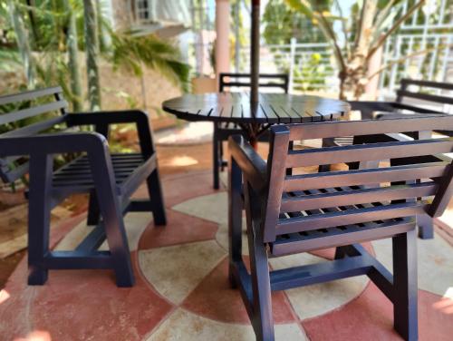 a group of tables and chairs sitting on a patio at Dodoma Siesta Inn in Dodoma